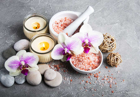 Spa products with orchids on a old gray stone backgroundの写真素材