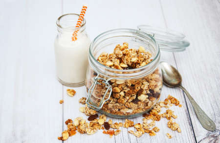 Homemade  granola in jar on a old wooden  tableの写真素材