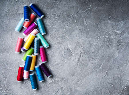 Colorful spools of thread on a table