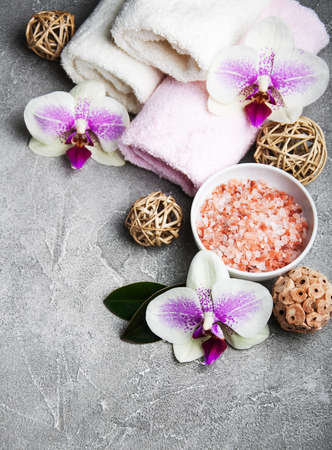 Spa products with orchids on a old gray stone backgroundの写真素材