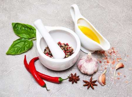 Different kind of spices on a  stone backgroundの写真素材