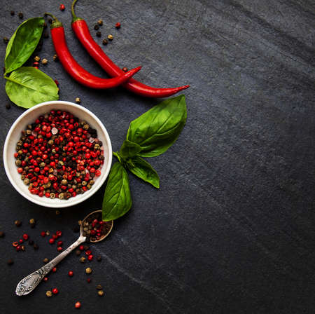 Different kind of spices  on black stone background