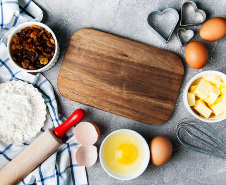 Kitchen table with various ingredients for baking cake