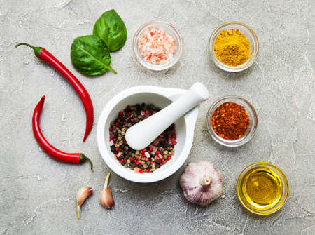 Different kind of spices on a  stone backgroundの写真素材