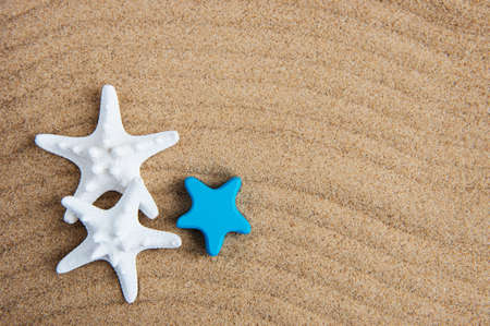 Decorative starfish on a natural sand background