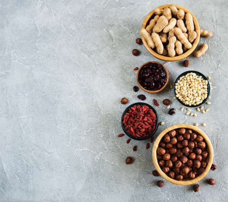 Dried fruits and nuts on a stone backgroundの写真素材