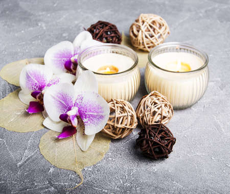 Spa products with orchids on a old gray stone backgroundの写真素材