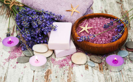 Spa products and lavender flowers on a old wooden backgroundの写真素材