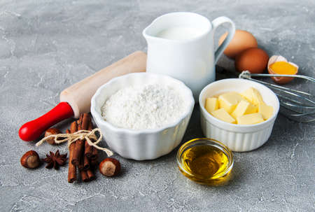 Kitchen table with various ingredients for baking cake