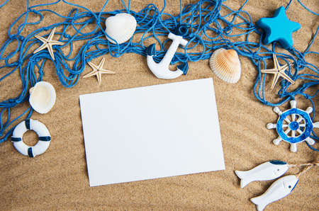 Holiday beach concept with shells, seastars and an blank postcardの写真素材