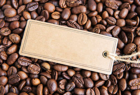 Coffee beans and price tag with copy space