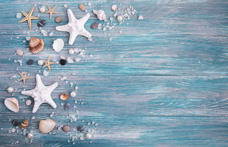 Sea salt and shells on a wooden backgroundの写真素材