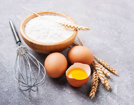 Baking ingredients - flour in bowl with eggs 