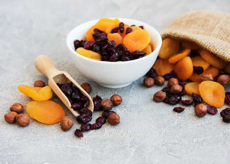 Dried fruits and nuts on a old wooden table