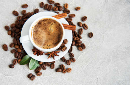 Cup of coffee and roasted coffee beansの写真素材