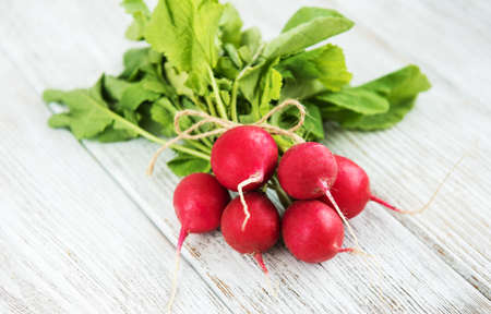 Bunch of radish on the wooden tableの写真素材