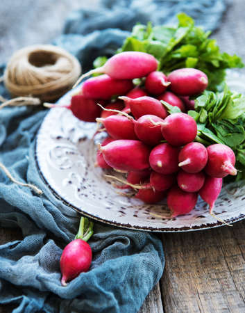 Bunch of radish on the wooden table