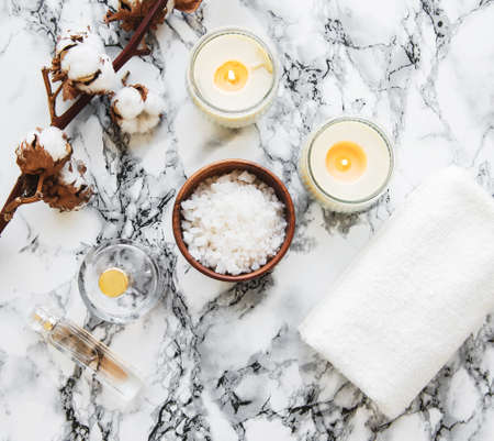 Spa products, towel, sea salt with cotton flowers