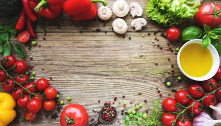 Healthy eating background - different raw vegetables on a old wooden tableの写真素材