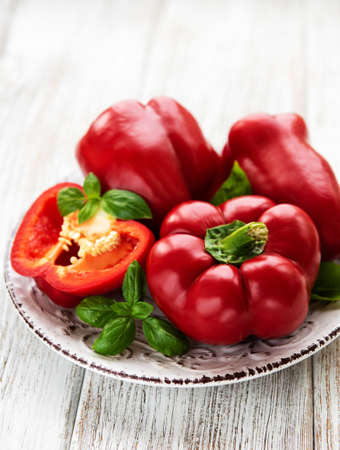 Bell peppers on a old white wooden backgroundの写真素材