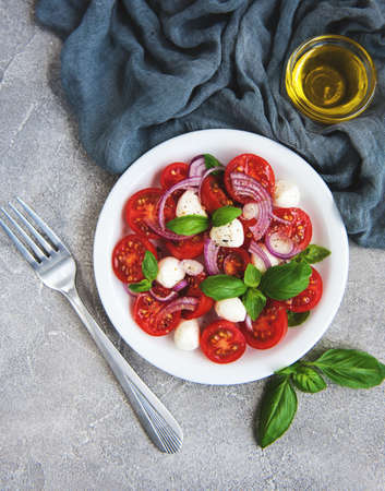 Italian caprese salad with cherry tomatoes and mozzarella
