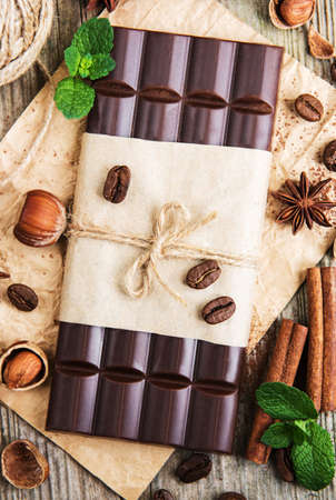 Chocolate and nuts on a old wooden table