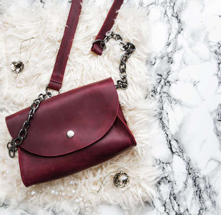 Leather bag and Christmas decorations - flat layの写真素材