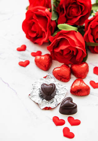 Valentines day romantic background -  chocolate candy and roses on a marble  backgroundの写真素材