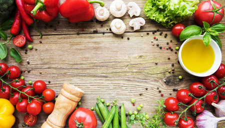 Healthy eating background - different raw vegetables on a old wooden tableの写真素材