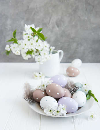 Plate with easter eggs and spring blossom