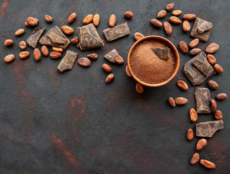 Natural  cocoa powder and cocoa beans  on a black backgroundの写真素材