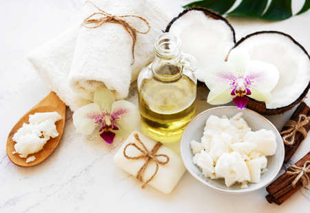 Coconut natural spa ingredients on a white marble backgroundの写真素材