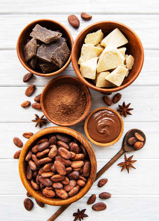 Natural  cocoa powder, cocoa butter and cocoa beans  on a wooden backgroundの写真素材