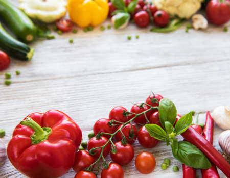 different raw vegetables on a old wooden table