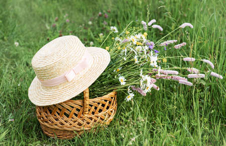 Beautiful bouquet of bright wildflowers in basket