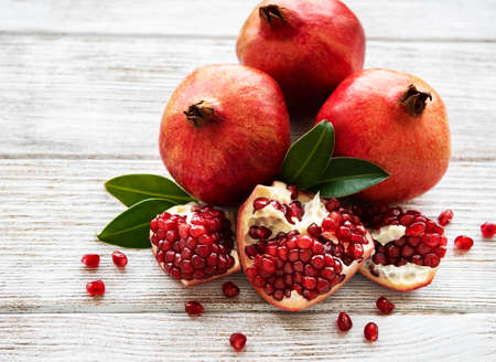 Ripe pomegranate fruits on  wooden vintageの写真素材