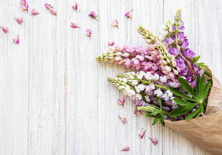 Pink  lupine flowers border on  old wooden backgroundの写真素材
