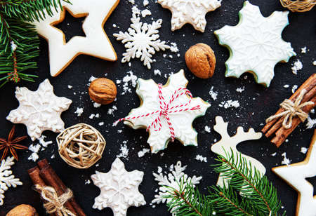 Christmas holiday gingerbread cookies on black concrete background, flat lay.の写真素材