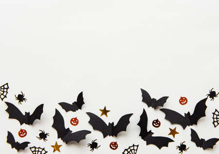 halloween  concept - black paper bats flying over grey backgroundの写真素材