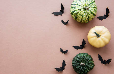 Halloween decorations on light brown background. Halloween concept. Flat lay, top view, copy space