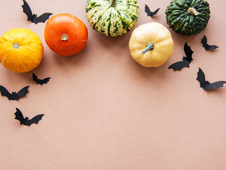 Halloween decorations on light brown background. Halloween concept. Flat lay, top view, copy spaceの写真素材
