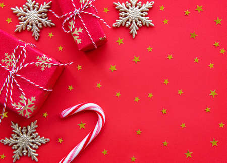 Christmas gift boxes and decorations on a red