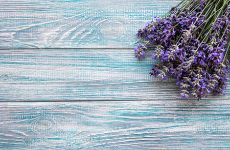 Fresh flowers of lavender bouquet on a white wooden background