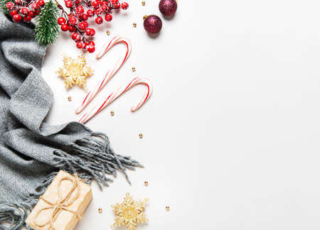 Christmas holiday background. Border made of  decorations on white background. Christmas, winter, new year concept. Flat lay, top view, copy spaceの写真素材