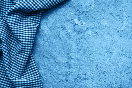 Checkered napkin on a  stone  toned classic blue colorの写真素材