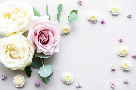 Flowers composition. Frame made of various colorful flowers on white  background. Flat lay, top view, copy spaceの写真素材