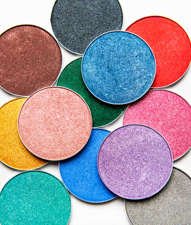 Assorted colors metallic blusher or eyeshadow  on white background. Flat lay, top viewの写真素材