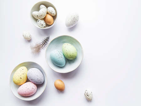 Colorful Easter eggs  in bowles. Easter holiday cincept, flat lay, top view.の写真素材