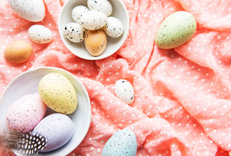 Colorful Easter eggs  in bowls. Easter holiday cincept, flat lay, top view.