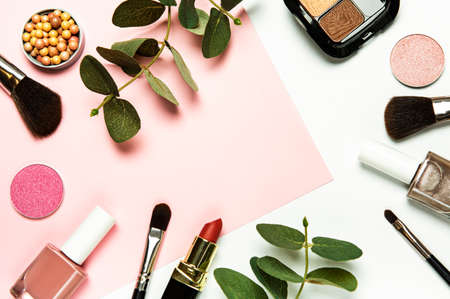 Set of decorative cosmetics on a white and pink background. Flat lay, top view.の写真素材